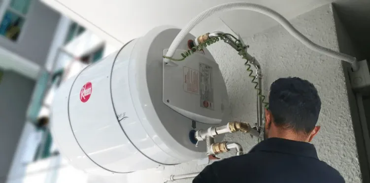 Compact Rheem water heater designed for restricted spaces like under benches, cupboards, or laundry areas.