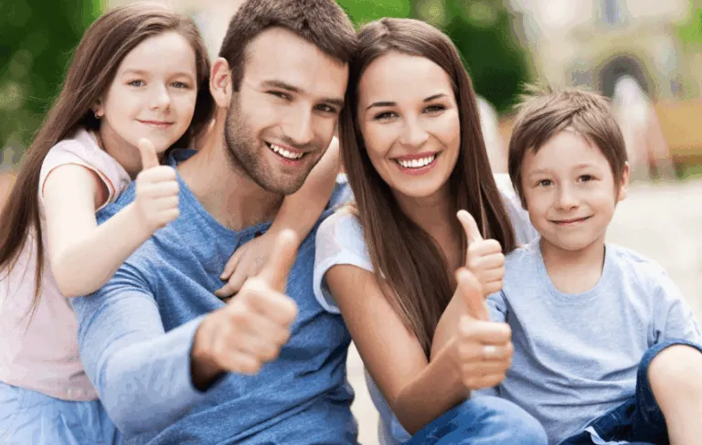 family giving thumbs up