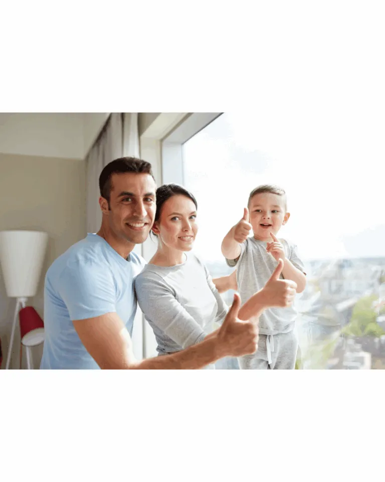 Happy family giving thumbs up