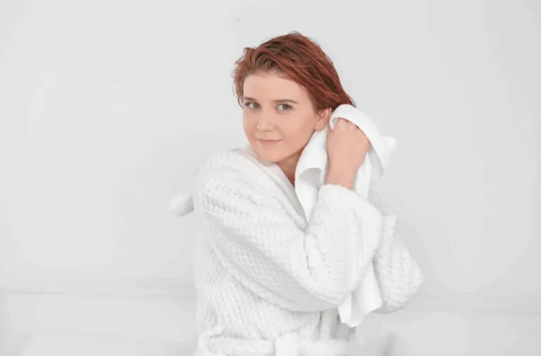 Young-Woman-Drying-Her-Hair-After-Shower-Photos-by-Canva-09-18-2025_10_32_AM-1