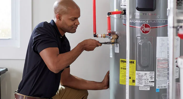 Plumber installing water heater